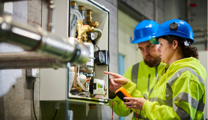 Technicians inspecting electrical equipment